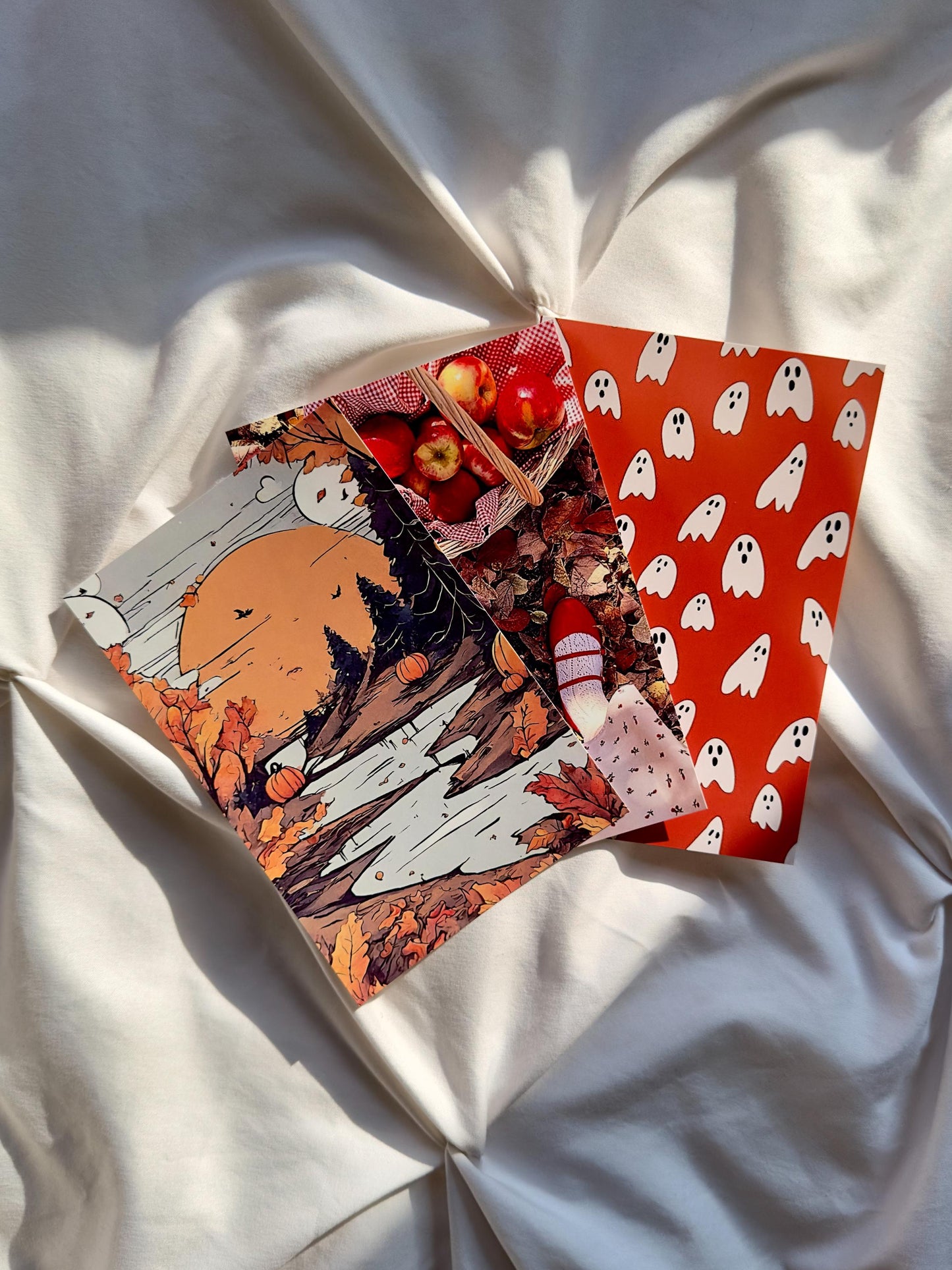 Three glossy art prints with fall and Halloween designs.