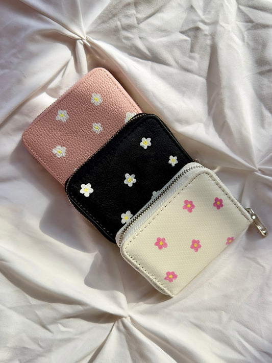 Handpainted daisy flower wallet in three colors; pink, black and white.